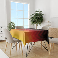 Rectangular gold and red striped tablecloth with Germany crest graphic on table
