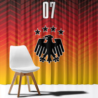Close-up of Germany football window curtain fabric: red chevrons, number 07, stars and crest.