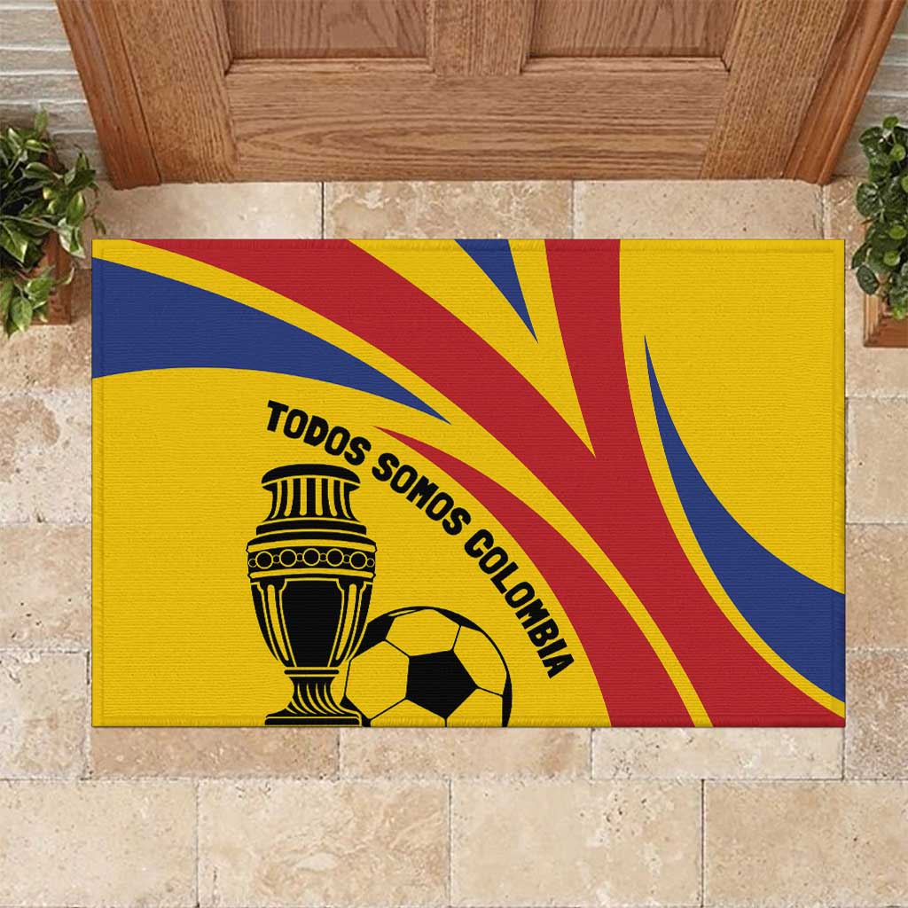 Yellow football rubber doormat with trophy, soccer ball, and 'TODOS SOMOS COLOMBIA' text