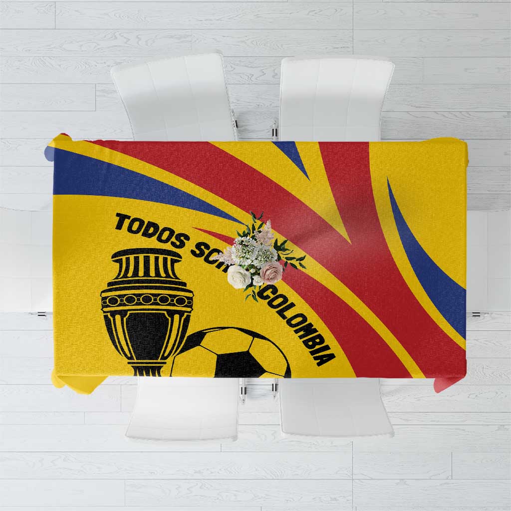 Gold football tablecloth featuring Colombia crest, soccer ball, and red-blue diagonal rays