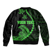 Black bomber jacket with green tribal design on back and ribbed hem