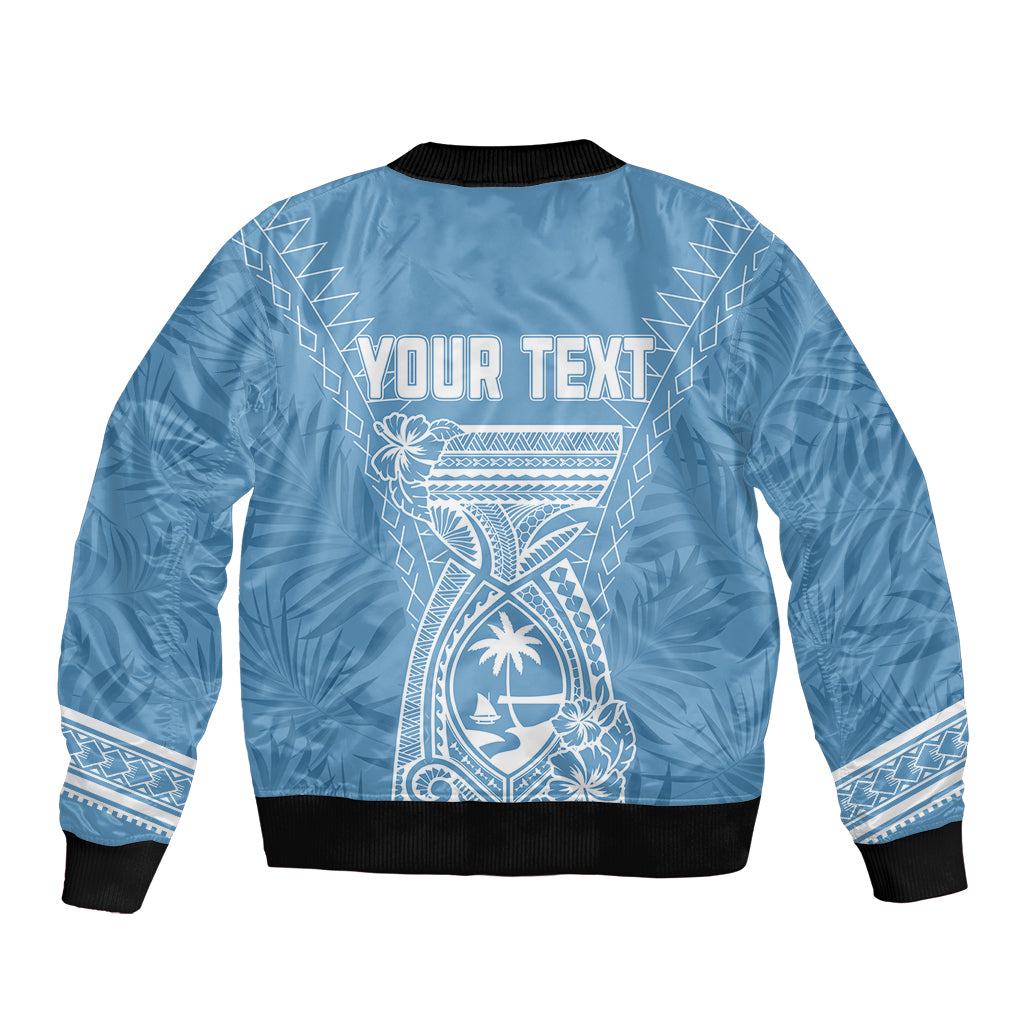 Blue bomber jacket back with centered graphic, black ribbed hem, and "YOUR TEXT" panel