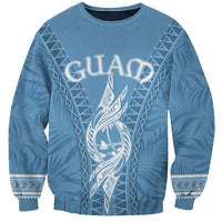 Unisex blue sweatshirt with Guam themed latte and tribal ornament graphic front