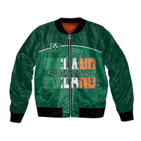 Green bomber jacket with zip front, ribbed cuffs, and Ireland rugby graphic crest on chest.