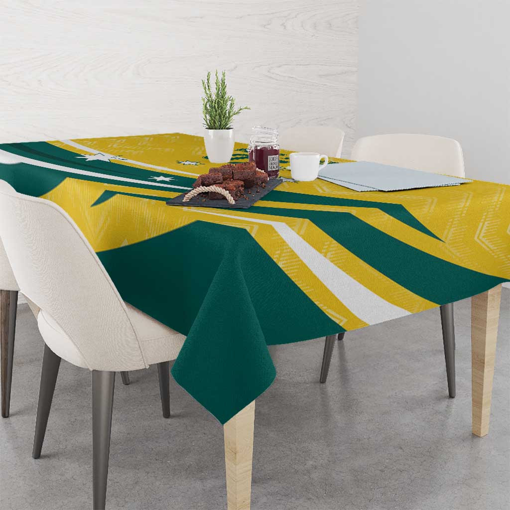 Custom tablecloth with yellow and green geometric pattern draped over dining table