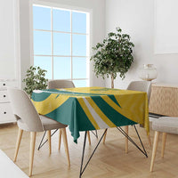 Custom tablecloth with yellow green stripe pattern on dining table with chairs