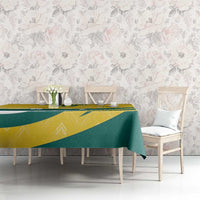 Custom tablecloth in yellow and green with bold geometric stripes over table
