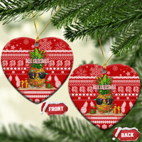 Red ceramic heart-shaped Christmas ornaments with pineapple scene and “Mele Kalikimaka”