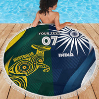 Round beach blanket with white fringe showing Australia kangaroo and India chakra, green and blue