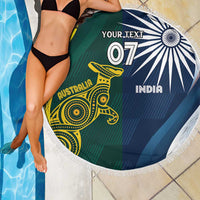 Round beach blanket with white fringe; Australia kangaroo and India chakra in green and blue