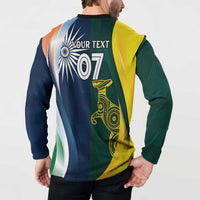Model wearing back of cricket pullover: "YOUR TEXT" 07 on blue/green/yellow split design