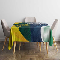 Half Australia and half India flag tablecloth on dining table with chairs, green and blue.