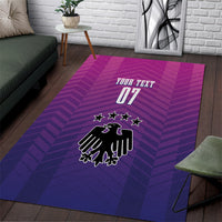 Rectangular purple and magenta patterned area rug with German crest, stars, and 'YOUR TEXT 07'