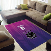Rectangular magenta and purple patterned area rug with German crest, stars, and 'YOUR TEXT 01'