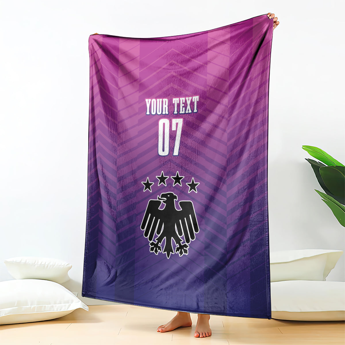 Germany football blanket draped, "YOUR TEXT 07" and eagle-style crest in purple.