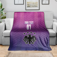 Germany football blanket on sofa, "YOUR TEXT 07" with star crest in purple.