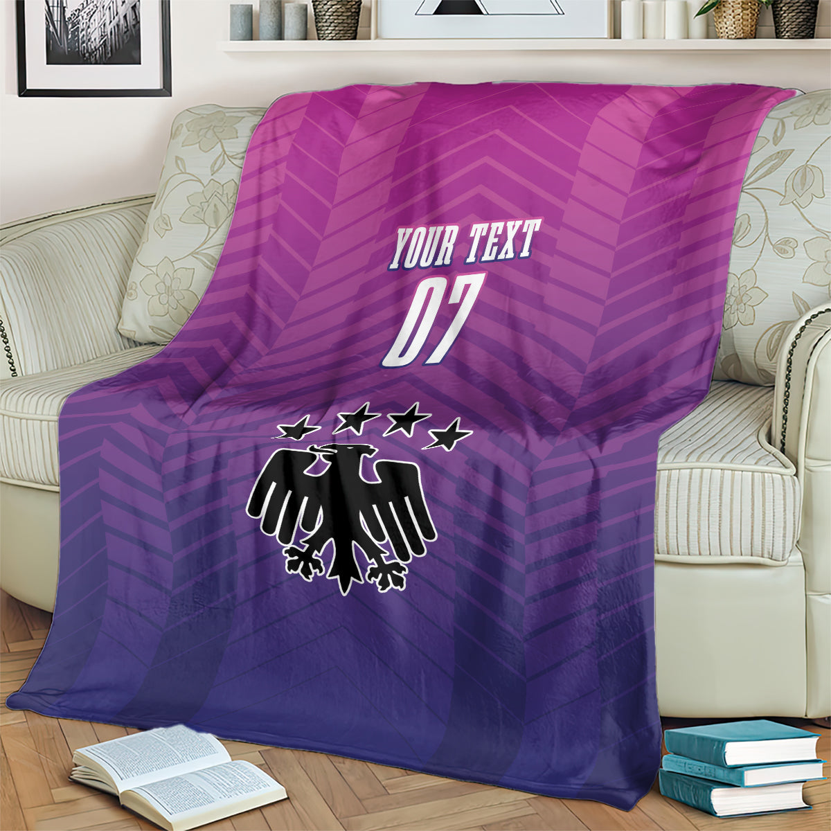 Germany football blanket on couch, purple gradient with "YOUR TEXT 07" and crest.