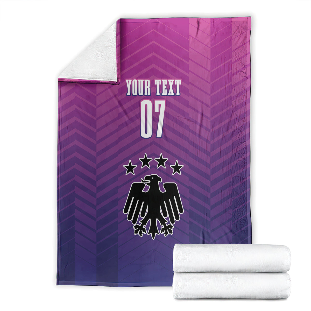 Germany football blanket folded, "YOUR TEXT 07" crest design with two rolled white towels.