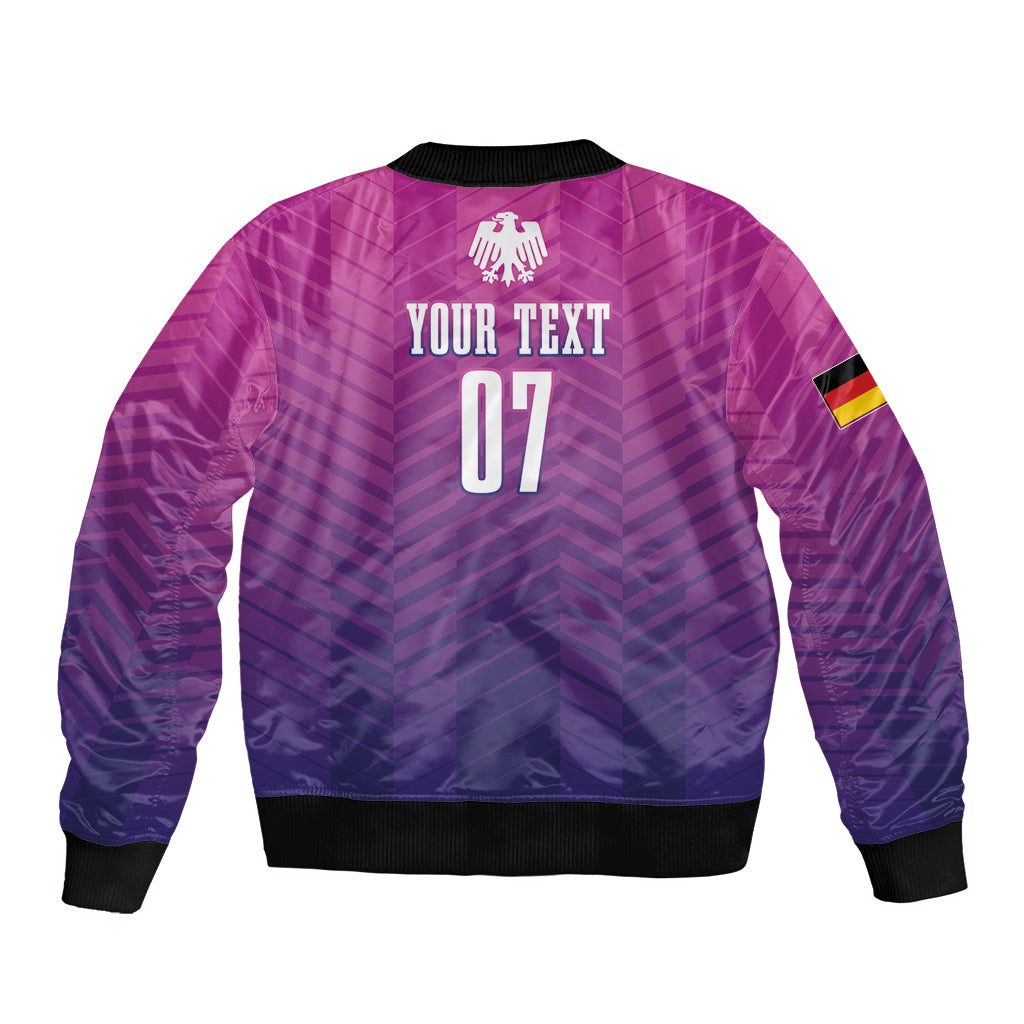 Unisex purple football bomber jacket with chevron pattern, back graphic, and elastic hem