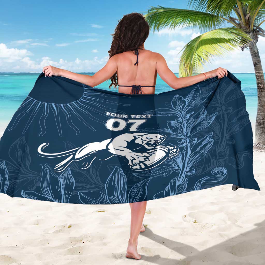 Royal blue sarong with “07” lion mascot and botanical line art, shown wrapped