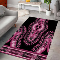 Black dashiki area rug with large pink ribbon icon and pink geometric border.
