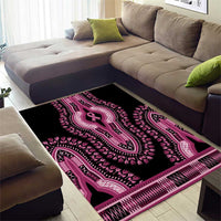 Black dashiki-style area rug with pink ribbon medallions and patterned border.