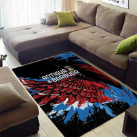 Black area rug with Antigua & Barbuda text over bold red and blue wings graphic
