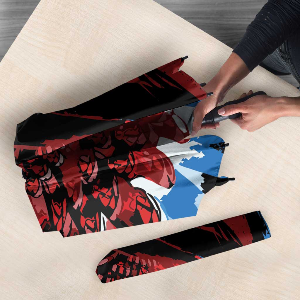 Folded umbrella with red and blue wing print and Antigua & Barbuda logo