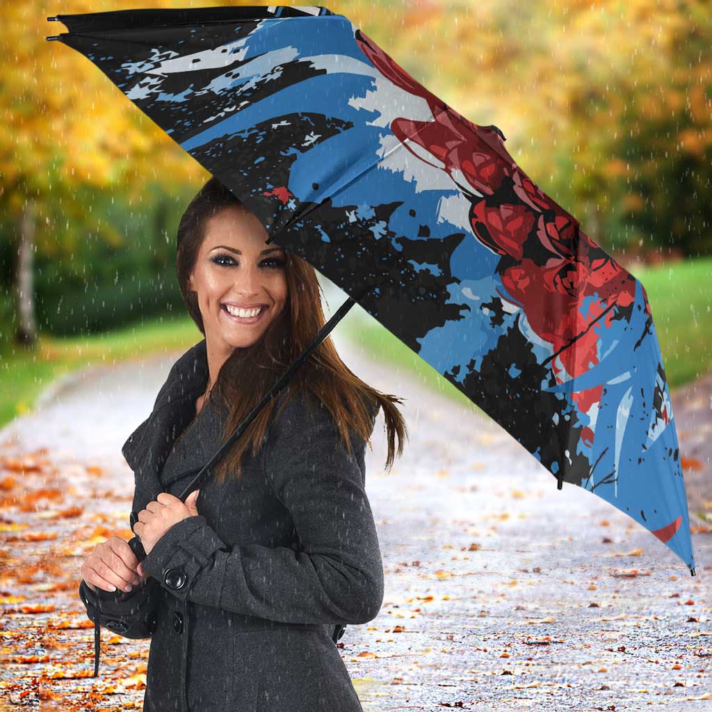 Black umbrella with Antigua & Barbuda logo and red rose with blue splatter wing print