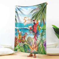 Tropical throw blanket draped upright, showing red parrot, ocean waves, palm leaves