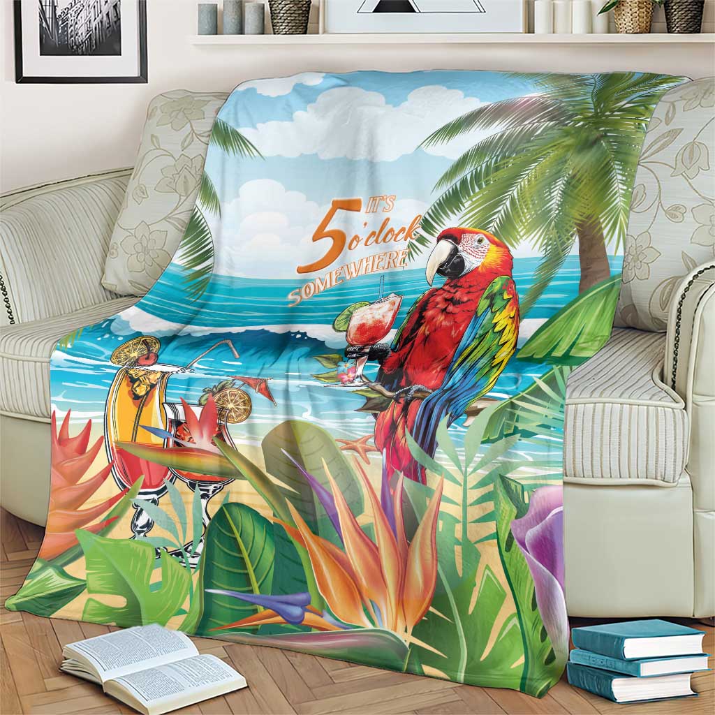 Tropical throw blanket over seating, featuring red parrot, palm leaves, and ocean horizon print