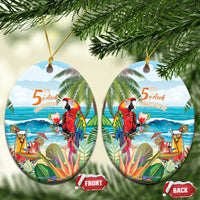 Two round ceramic Christmas ornaments with colorful tropical parrot and “5 o’clock somewhere”