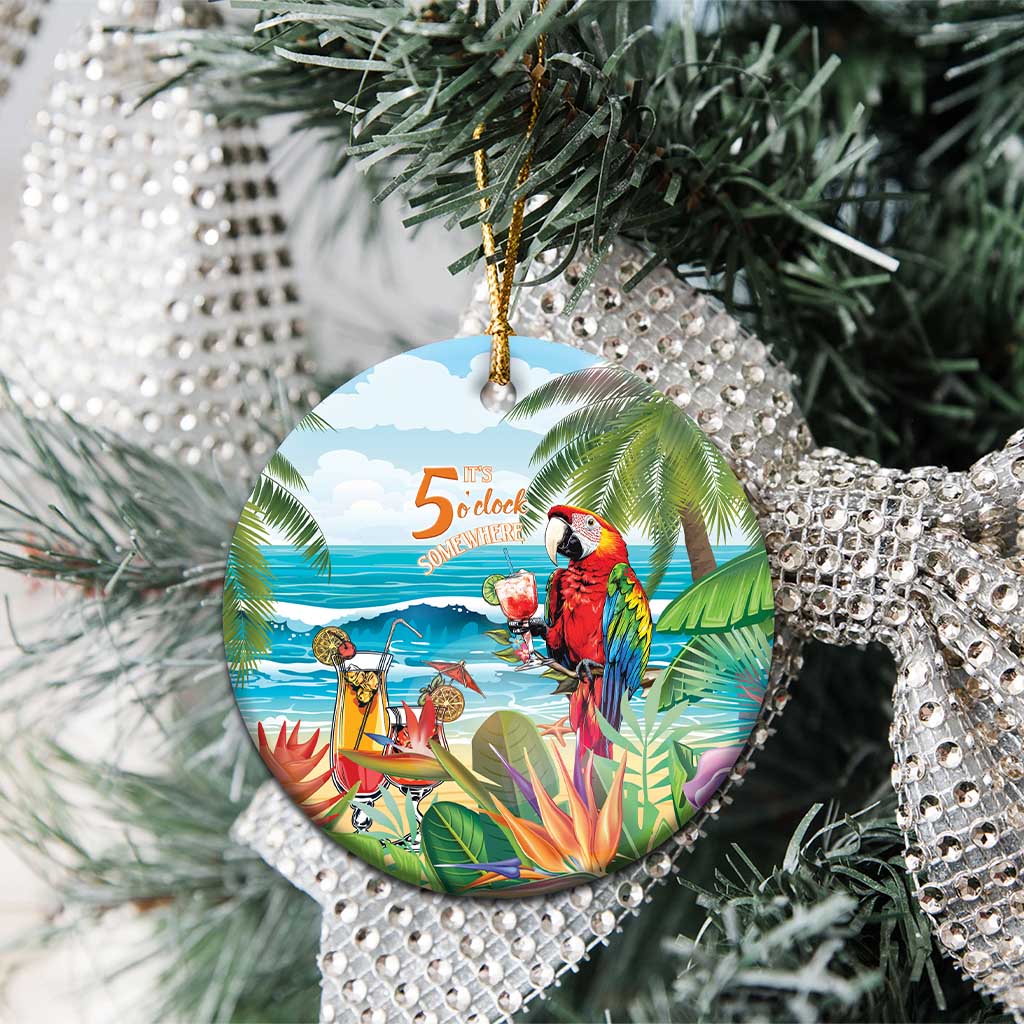 Round ceramic Christmas ornament with colorful tropical parrot and ocean “5 o’clock somewhere”