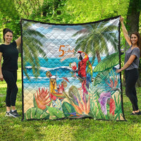 Colorful tropical quilt spread outdoors, featuring parrot, ocean waves, and palm leaves