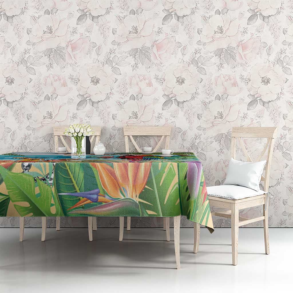 Colorful tropical tablecloth with parrot and palm leaf pattern across the table