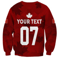 Women’s red soccer sweatshirt with maple leaf emblem, number 07, and “YOUR TEXT”
