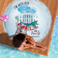 Round beach blanket in light blue with fringe edge, campaign text and shoes