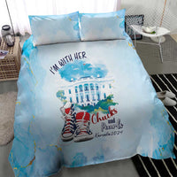 Blue duvet and pillow set with “I'm with her” text and Chucks and Pearls logo