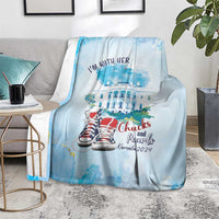 Light blue blanket draped on sofa with 'I'm with her' text and red sneakers graphic