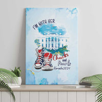 Blue canvas wall art featuring a white building illustration, red sneakers, and “I’m with her.”