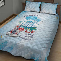 Light blue quilt bed set with quilted diamond pattern and sneaker graphic on top surface