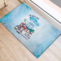 Light blue rubber doormat showing 'I'm With Her' over building and red sneakers