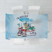 Light blue tablecloth with sneaker and city graphic plus "Chuck's Pearls" text