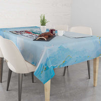 Light blue tablecloth with city print and soft painterly blue streaks