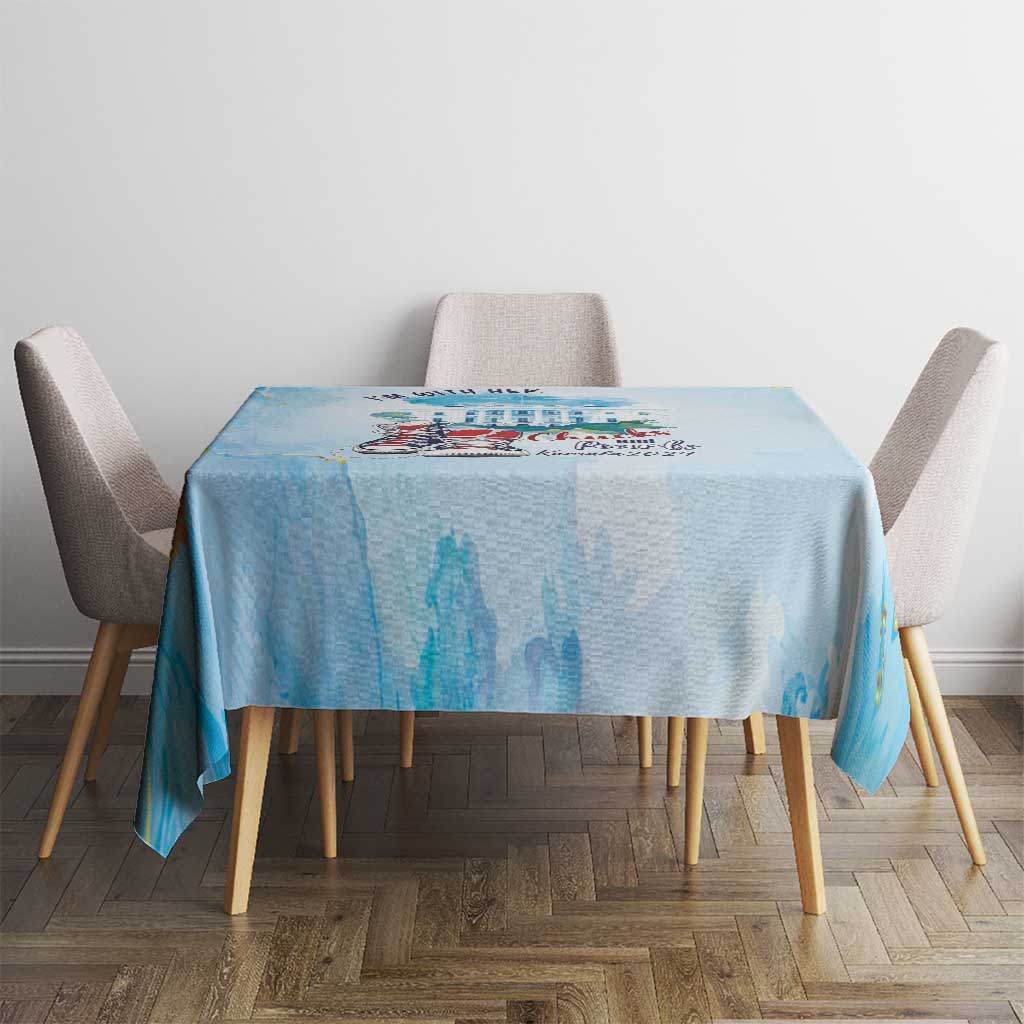 Light blue tablecloth with cityscape graphic and "I'm With Her" text