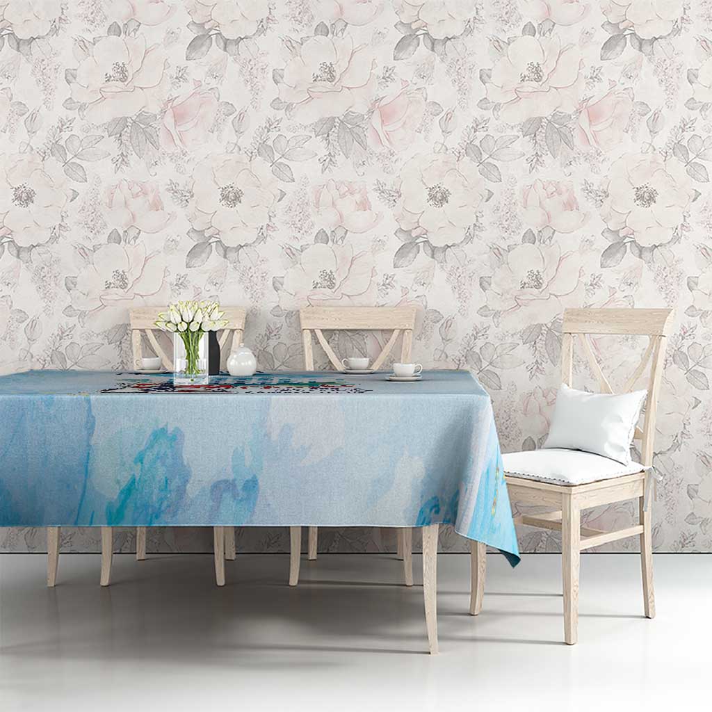 Light blue tablecloth with cityscape and sneaker graphic across the top