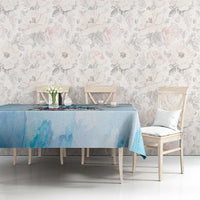 Light blue tablecloth with cityscape and sneaker graphic across the top