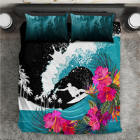 Surfing bedding set with black, white and teal wave surfer graphic, plus teal accent pillows