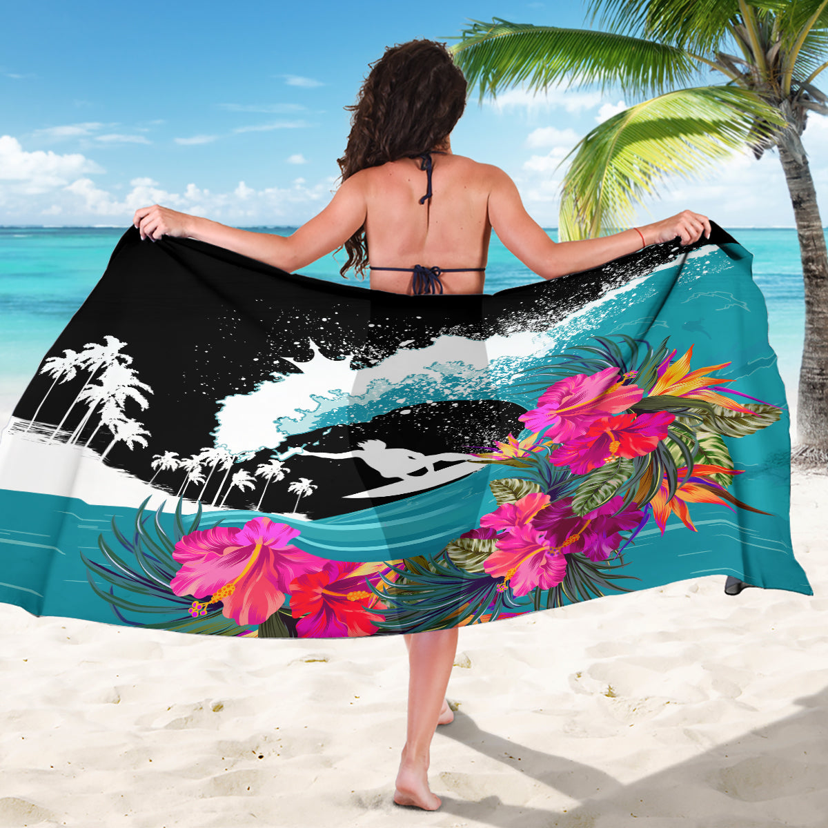Teal tropical sarong with black-and-white wave and surfer print, pink flower accents