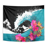 Black surf rider tapestry close-up with turquoise waves, pink flowers, and palm tree line
